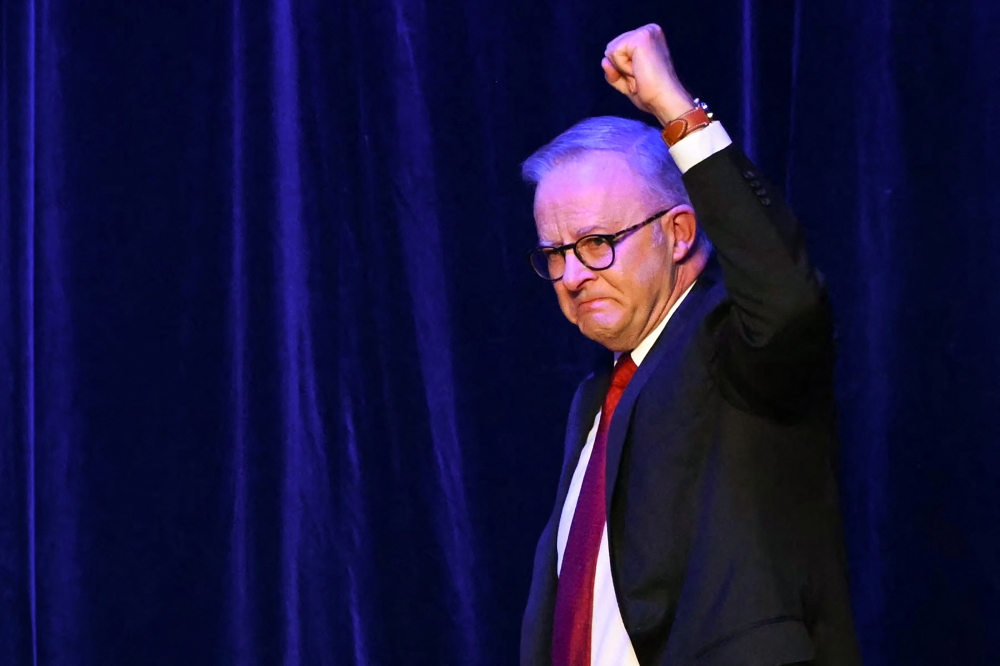Australia's Prime Minister Anthony Albanese arrives onstage after winning the general election at the Labor Party election night event in Sydney on May 3, 2025. (Photo by Saeed KHAN / AFP)