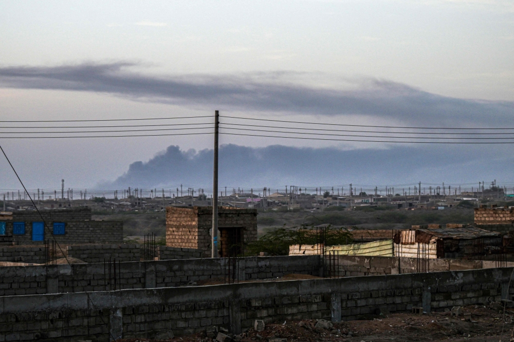Smoke rises from the airport of Port sudan following reported attacks early on May 4, 2025.(Photo by AFP)
