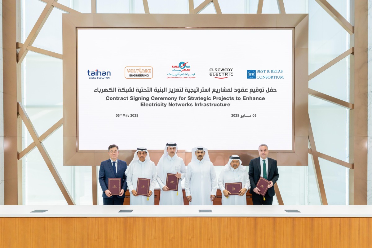 Minister of State for Energy Affairs H E Saad Sherida Al-Kaabi (third right) and other officials at the contracts signing ceremony yesterday. (STORY ON PAGE 1)