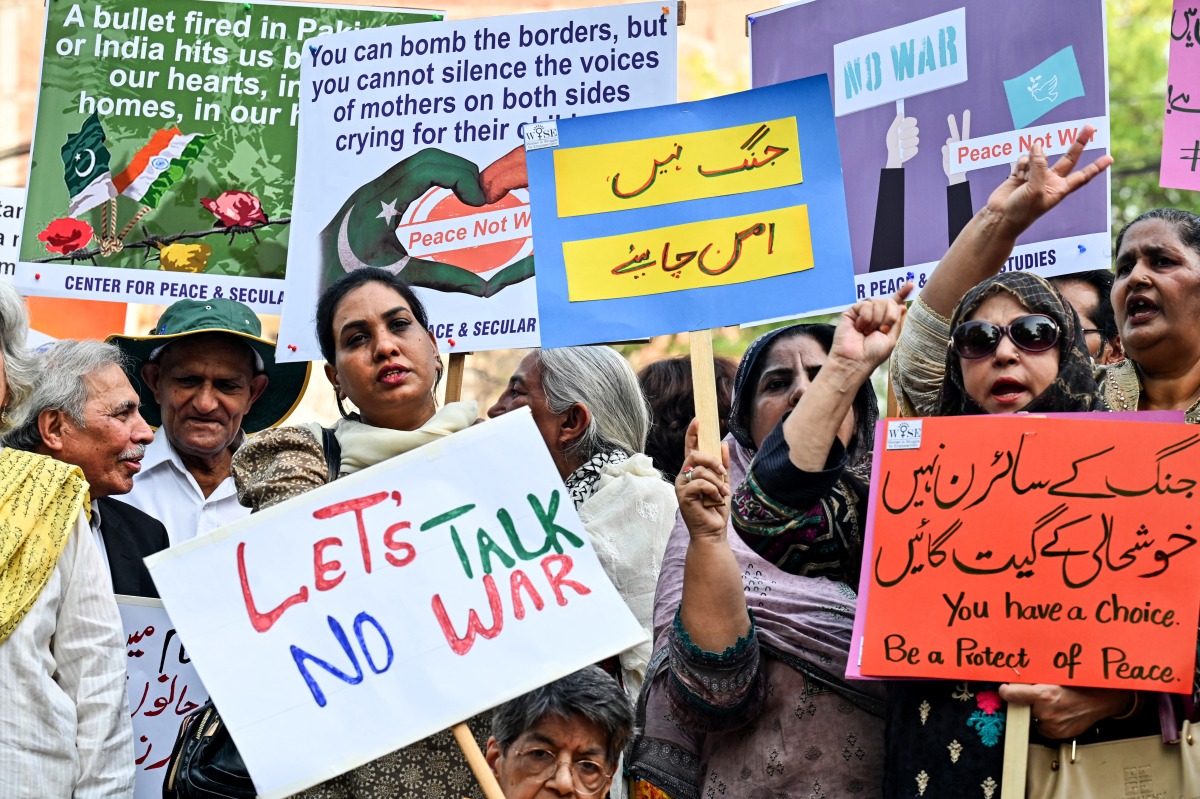 Photo used for representational purposes. Members of civil society take part in a peace rally in Lahore on May 6, 2025. Photo by Arif ALI / AFP.