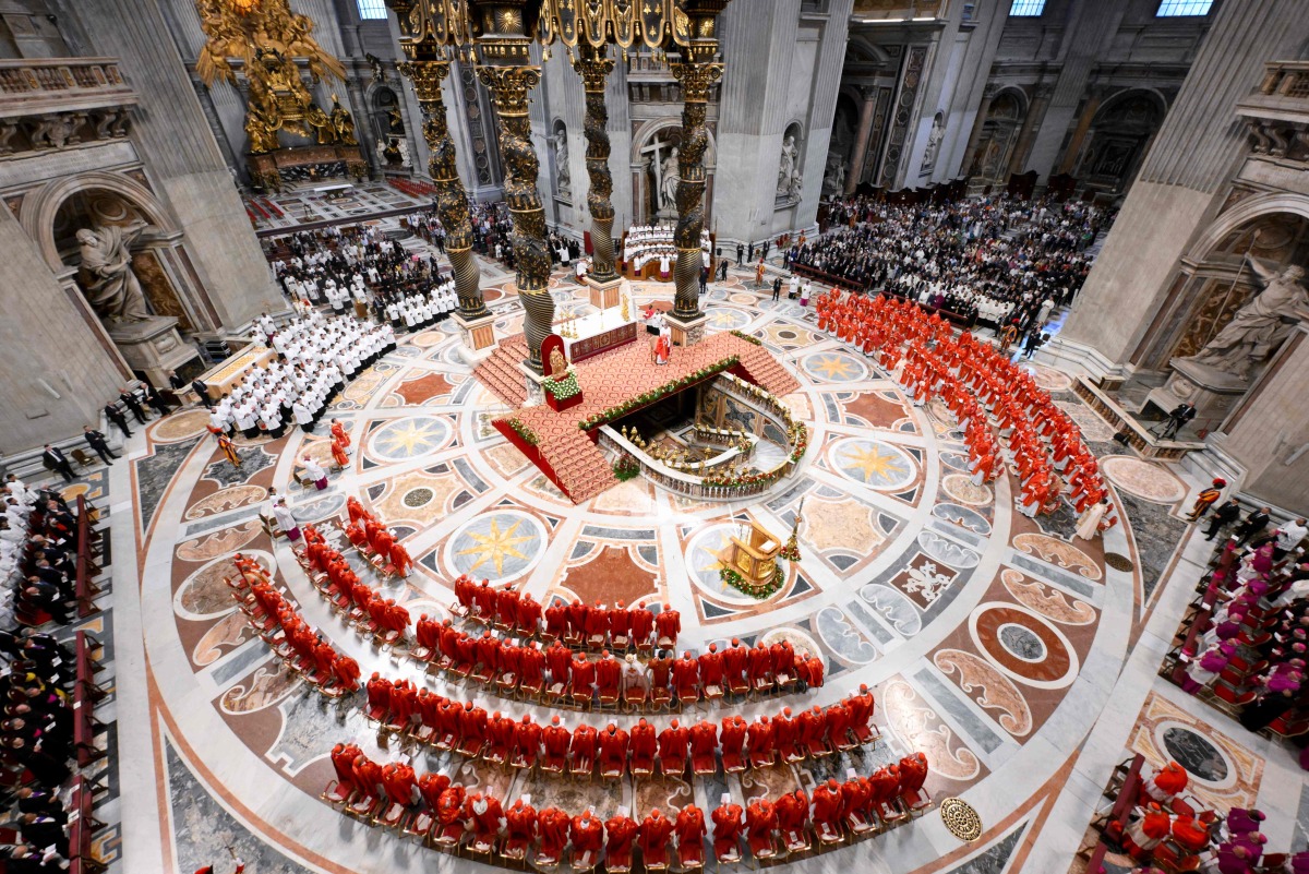 This photo taken and handout on May 7, 2025 by The Vatican Media shows cardinals during a holy mass for the Election of the Roman Pontiff, prior to the start of the conclave, at St Peter's Basilica in The Vatican. (Photo by Handout / VATICAN MEDIA / AFP) 