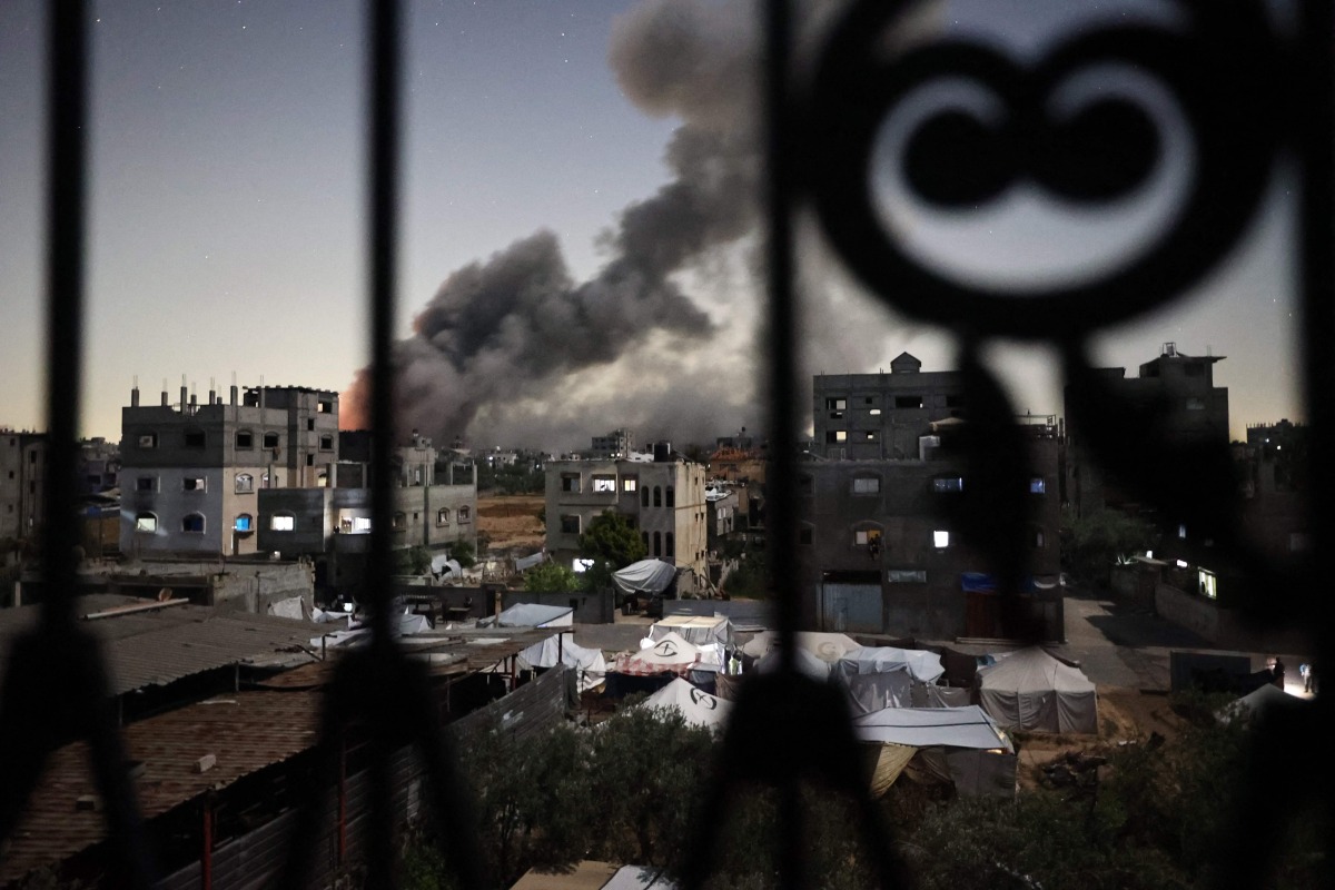 Smoke rises following an Israeli strike in the Bureij refugee camp in the centre of the Gaza Strip, on May 6, 2025. Photo by Eyad BABA / AFP