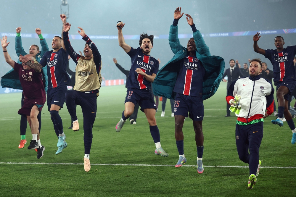 PSG's players celebrate their victory at the end of the UEFA Champions League semi-final second leg football match in Paris, on May 7, 2025. (Photo by Franck Fife / AFP)