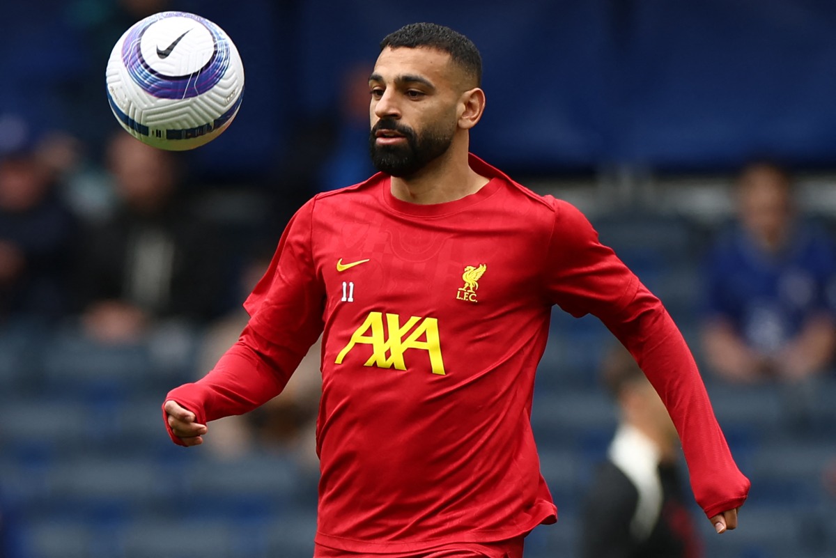 Liverpool's Egyptian striker #11 Mohamed Salah warms up ahead of the English Premier League football match between Chelsea and Liverpool at Stamford Bridge in London on May 4, 2025. (Photo by HENRY NICHOLLS / AFP)