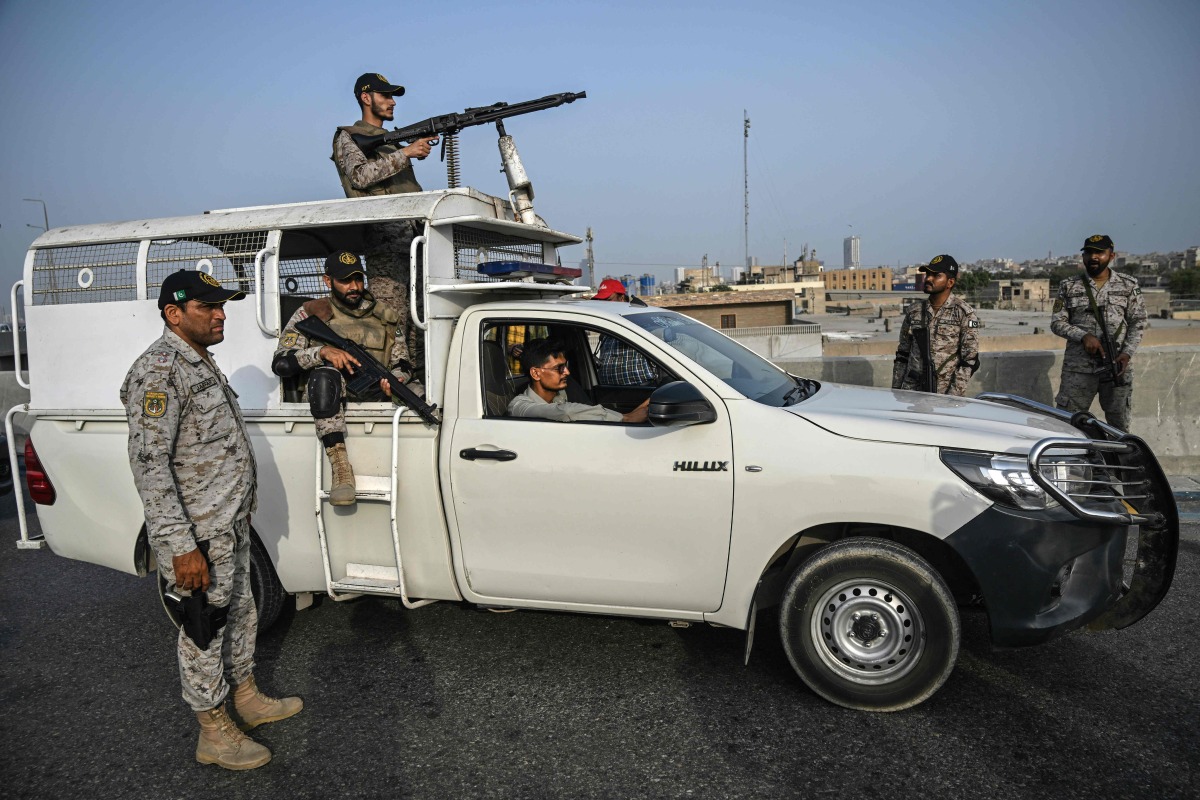 Security personnel stands guard near the Karachi Port in Karachi on May 9, 2025, amid the ongoing border tensions between India and Pakistan after the Kashmir tourist attack. (Photo by Rizwan TABASSUM / AFP)

