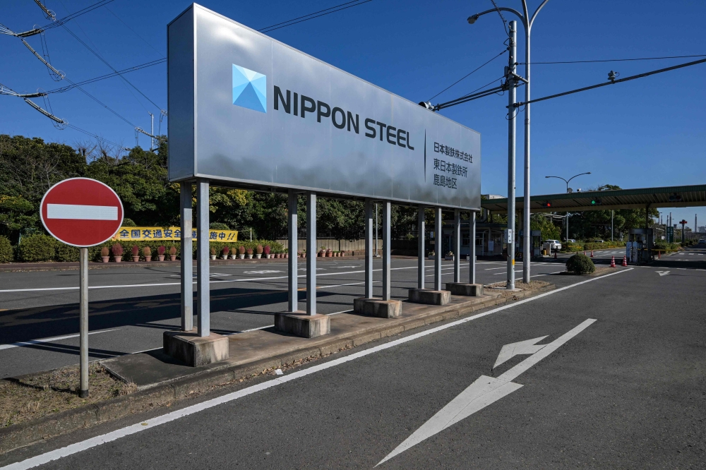 File: An entrance sign for Japanese company Nippon Steel's East Nippon Works Kashima Area facility is pictured in Kashima, Ibaraki prefecture, north of Tokyo on December 6, 2024. (Photo by Richard A Brooks / AFP)