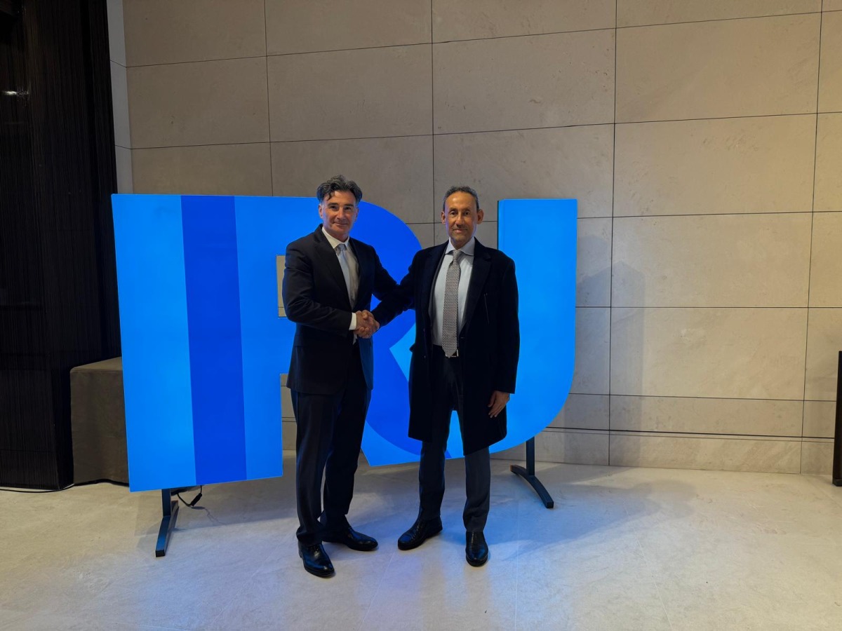 Officials pose for a picture during the meeting.