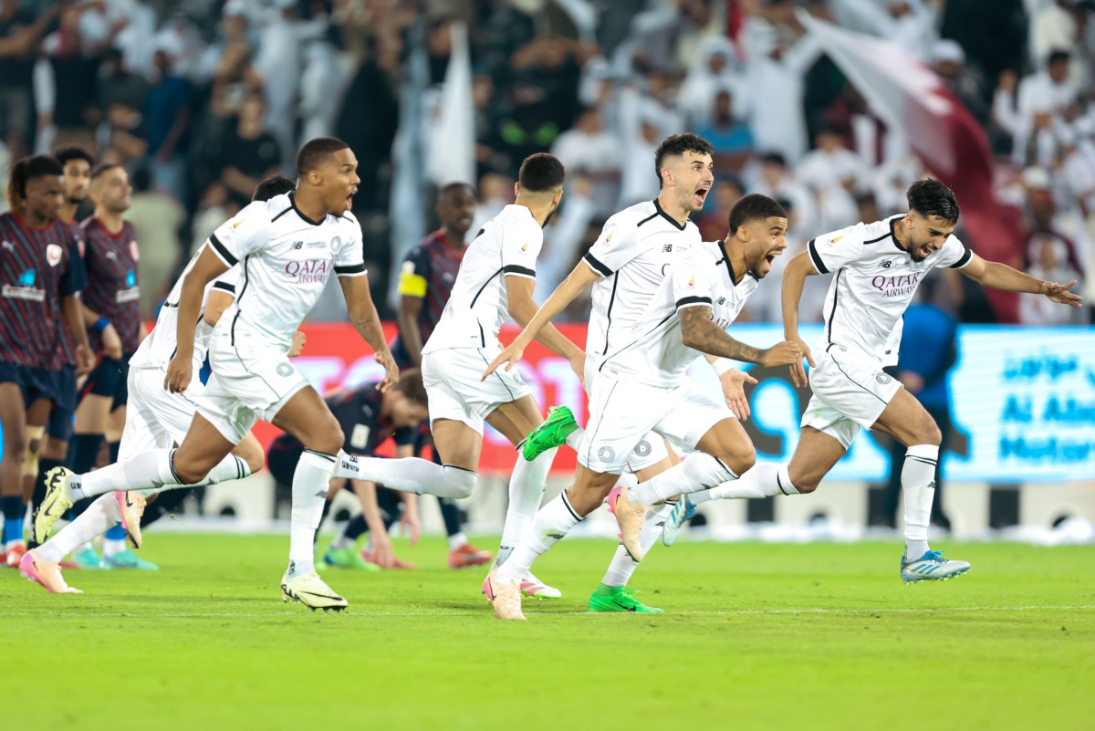 Al Sadd players celebrate their win in Qatar Cup final.