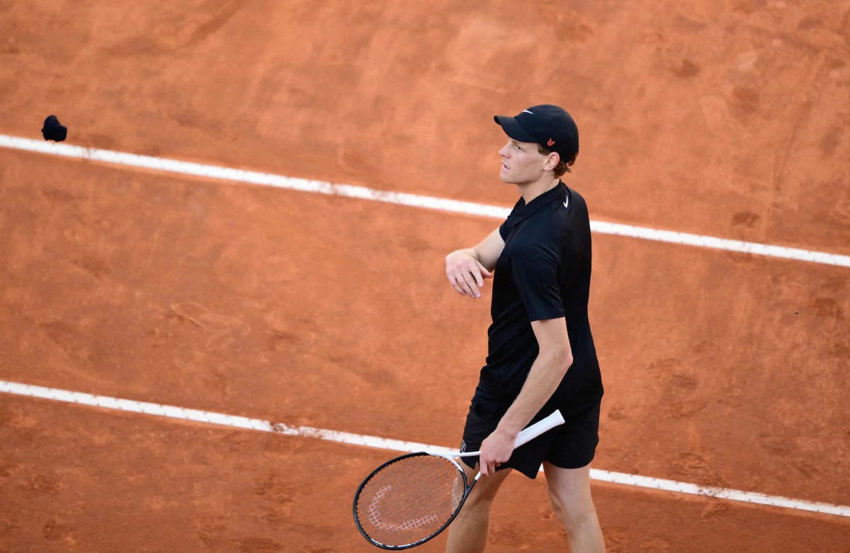 Italy's Jannik Sinner throws his cuff to the public as he celebrates winning against Netherland Jesper De Jong at the end of their round of 16 men's singles match of the WTA Rome Open tennis tournament at Foro Italico in Rome on May 12, 2025. (Photo by Marco BERTORELLO / AFP)
