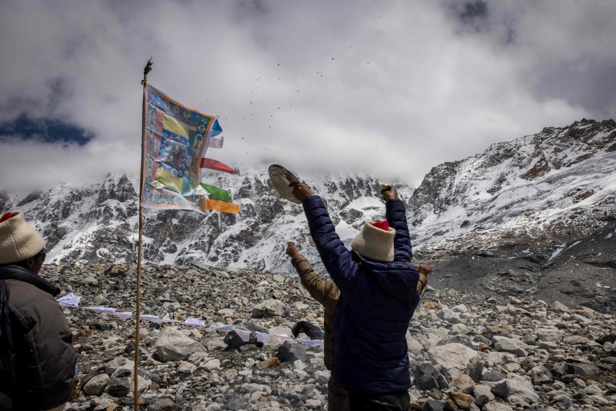 In this handout photo taken and released by the International Centre for Integrated Mountain Development (ICIMOD) on May 12, 2025, Nepali monks during a tribute ceremony for the Yala Glacier in Langtang Valley. (Photo by Jitendra Raj Bajracharya / International Centre for Integrated Mountain Development (ICIMOD)