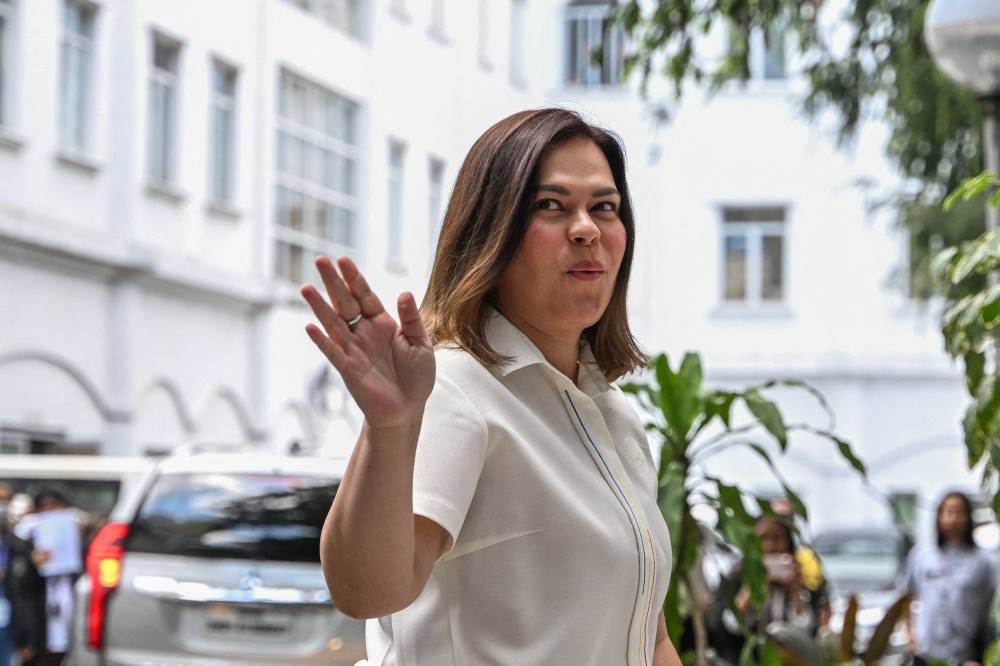 (Files) This file photo taken on May 9, 2025, shows Philippine Vice President Sara Duterte arrives to file her counter affidavit at the Department of Justice in Manila. (Photo by Jam Sta Rosa / AFP)