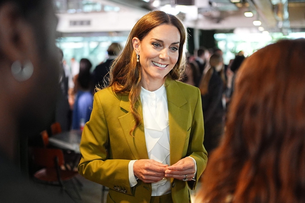 Britain's Catherine, Princess of Wales smiles during a visit to present 