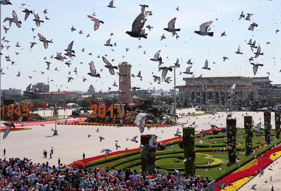 White doves are released at the end of the commemoration activities marking the 70th anniversary of the victory of the Chinese People's War of Resistance Against Japanese Aggression and the World Anti-Fascist War, in Beijing, capital of China, Sept. 3, 2015. (Xinhua/Pang Xinglei)

