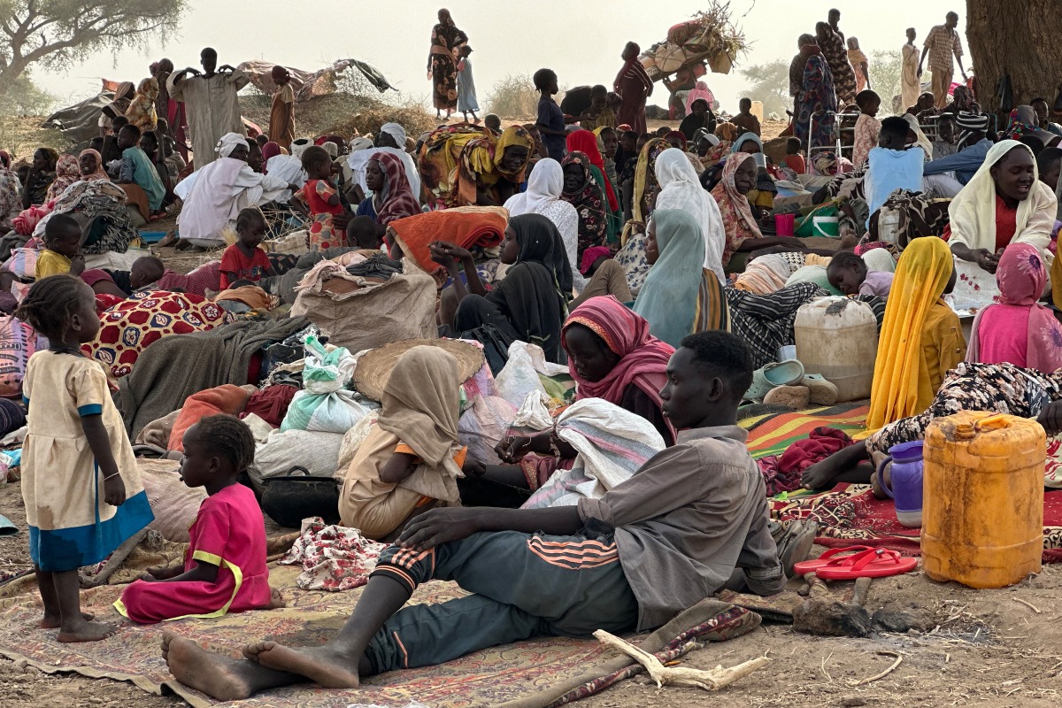 (FILES) People who fled the Zamzam camp for the internally displaced after it fell under RSF control, rest in a makeshift encampment in an open field near the town of Tawila in war-torn Sudan's western Darfur region on April 13, 2025. (Photo by AFP)
