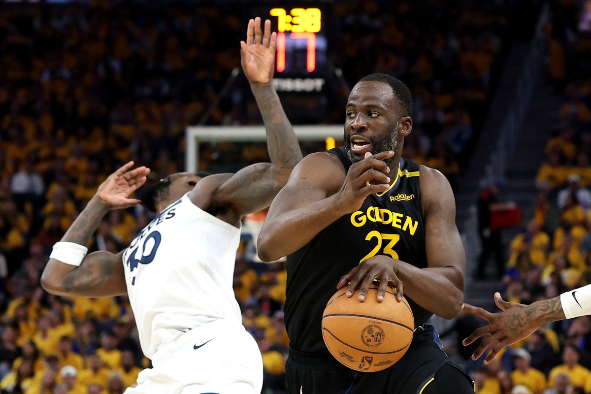 Draymond Green #23 of the Golden State Warriors dribbles the ball against Julius Randle #30 of the Minnesota Timberwolves during the third quarter in Game Four of the Western Conference Second Round NBA Playoffs at Chase Center on May 12, 2025 in San Francisco, California. (Photo by EZRA SHAW / GETTY IMAGES NORTH AMERICA / Getty Images via AFP)
