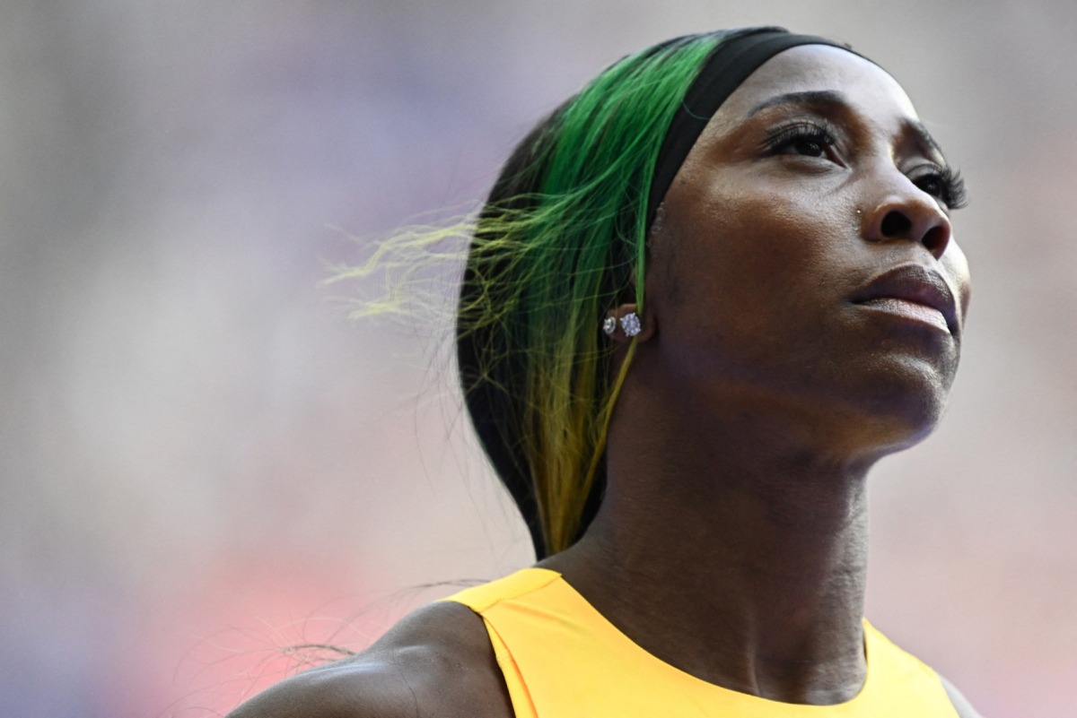 Jamaica's Shelly-Ann Fraser-Pryce reacts after competing in the women's 100m heat of the athletics event at the Paris 2024 Olympic Games at Stade de France in Saint-Denis, north of Paris, on August 2, 2024. (Photo by Jewel Samad / AFP)
