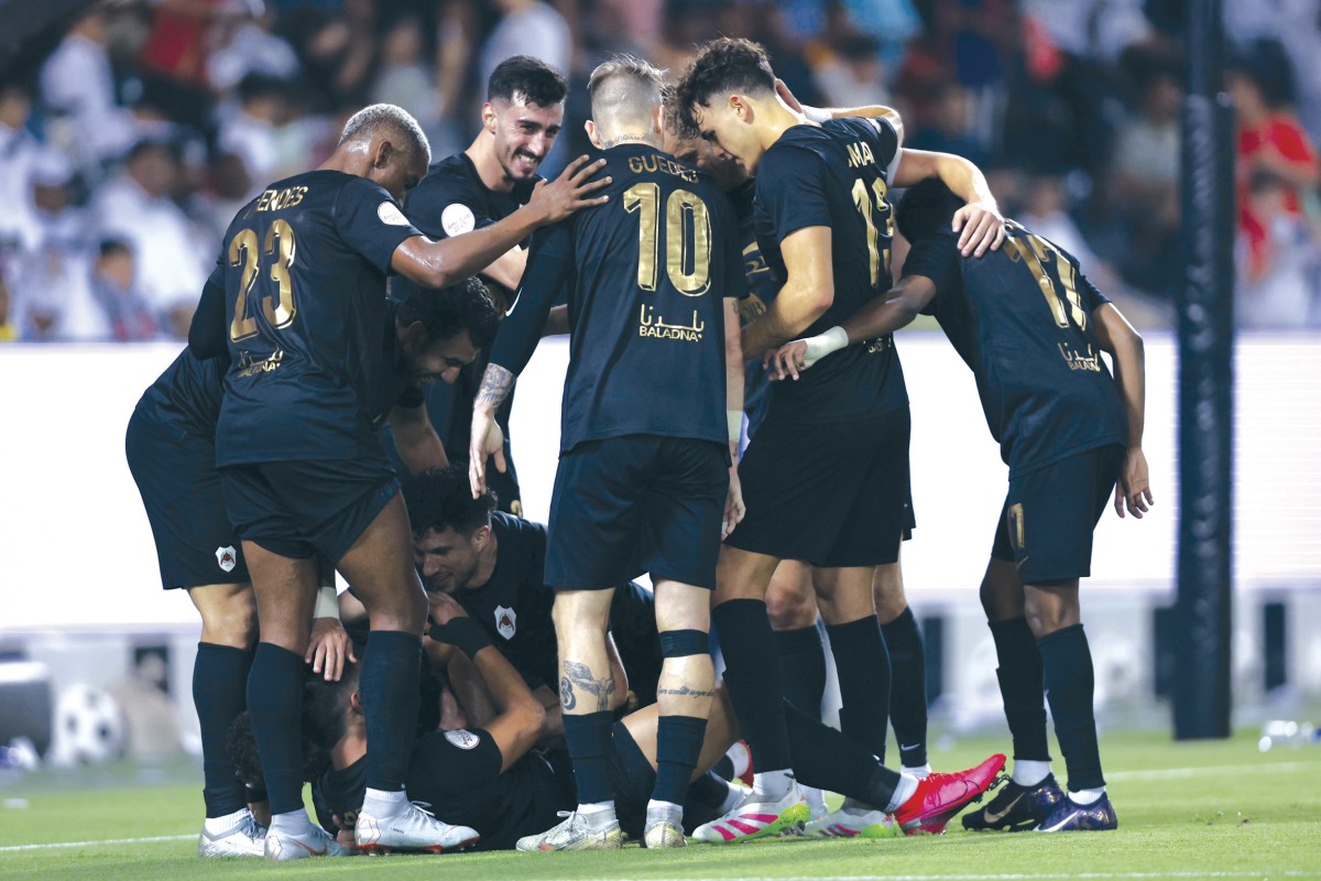 Al Rayyan players celebrate after Adam Bareiro scored a goal.