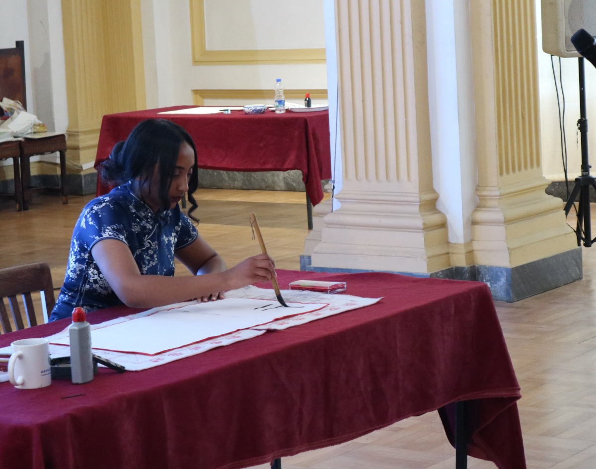  A contestant displays Chinese calligraphy at the 24th 
