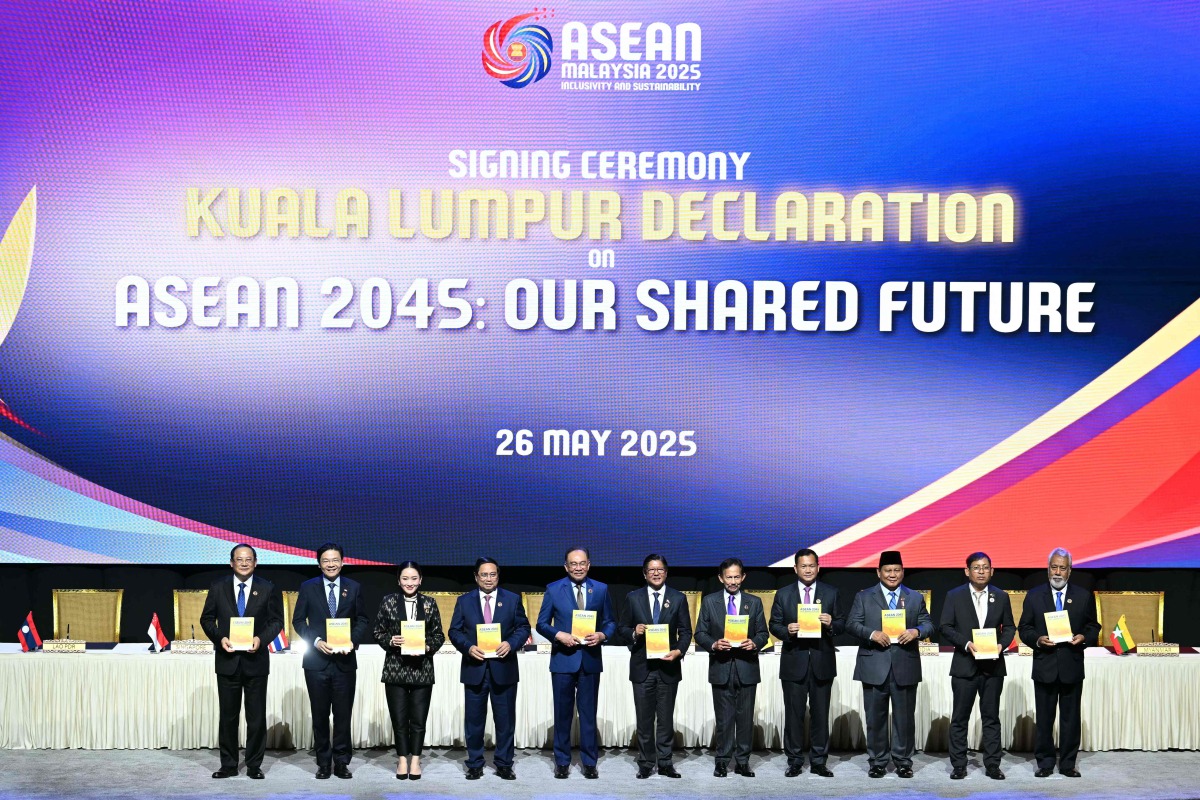 (From L to R) Laos' Prime Minister Sonexay Siphandone, Singapore's Prime Minister Lawrence Wong, Thailand's Prime Minister Paetongtarn Shinawatra, Vietnam's Prime Minister Pham Minh Chinh, Malaysia's Prime Minister Anwar Ibrahim, Philippines' President Ferdinand Marcos Jr, Sultan of Brunei Hassanal Bolkiah, Cambodia's Prime Minister Hun Manet, Indonesia's President Prabowo Subianto, Myanmar's Permanent Secretary of the Ministry of Foreign Affairs Aung Kyaw Moe and East Timor's Prime Minister Xanana Gusmao pose after the signing ceremony of the Kuala Lumpur declaration at the 46th Association of Southeast Asian Nations (ASEAN) Summit in Kuala Lumpur on May 26, 2025. (Photo by ARIF KARTONO / AFP)
 