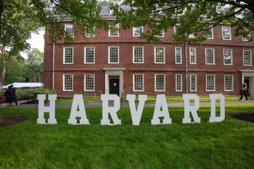 A Harvard sign is seen at the Harvard University campus in Boston, Massachusetts, on May 27, 2025. (Photo by Rick Friedman / AFP)