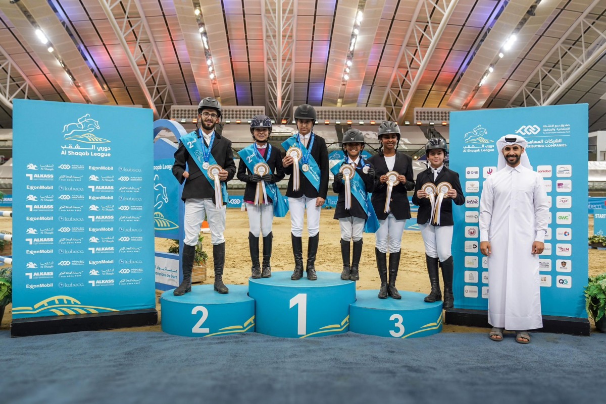 Top six riders of the Intro 80cm class celebrate their success, led by Alya Hamad Jassim Al Thani, followed by Melina Karagiannidi and Adel Abdel Raziq. Salman Faisal Al Marri, Maryam Ahmed Mohamood Erbad, and Jassim Saoud Al Fakhroo complete the top six in the event at Al Shaqab yesterday.
