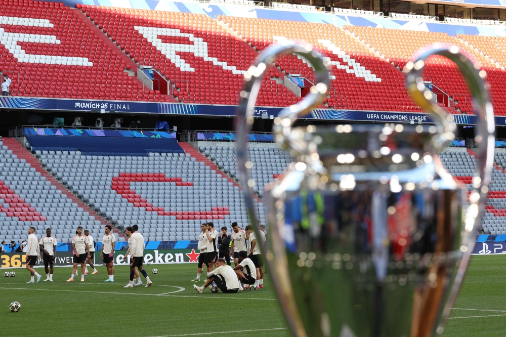 Paris Saint-Germain's players train in front of the Champions League Trophy during the MD-1 training session, on May 30, 2025. (Photo by Franck FIFE / AFP)