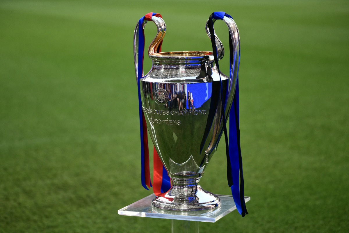 The UEFA Champions League trophy is displayed on the pitch at the Allianz Arena stadium before the UEFA Champions League final football match between Paris Saint-Germain (PSG) and Inter Milan in Munich, southern Germany, on May 31, 2025.