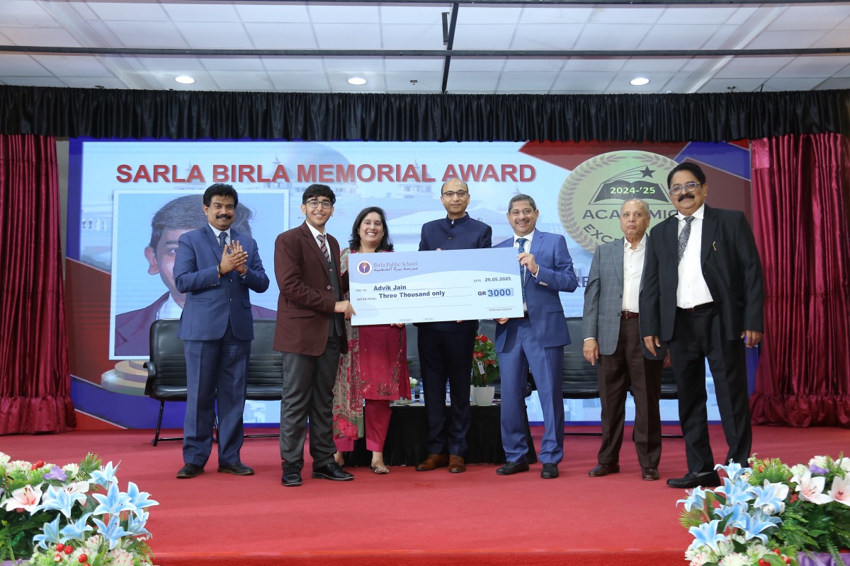Officials and guests with a winner at awards ceremony.