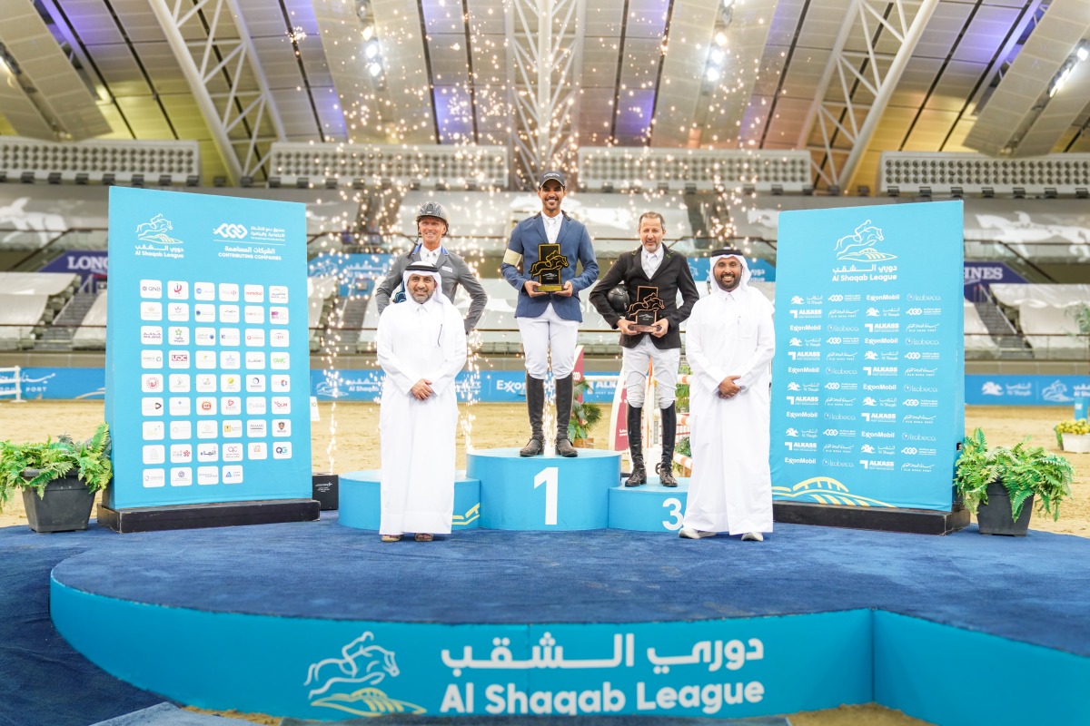 First-place winner Mohammed Saeed Haidan (centre), runner-up Thorsten Wittenberg (left), and third-place finisher Khaled Abdulaziz Al Eid pose on the podium after being crowned the overall top three of the Al Shaqab Champions. 