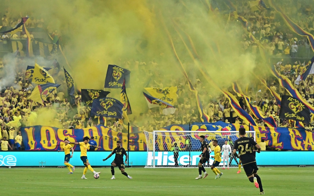 America's supporters cheer during a play-in match between LAFC and Club America for the final spot in the 2025 FIFA Club World Cup, at BMO Stadium in Los Angeles, California, on May 31, 2025. (Photo by Frederic J. Brown / AFP)