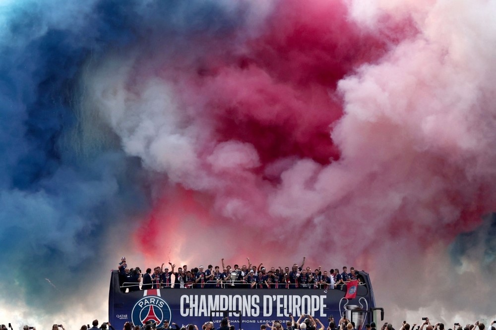 Paris Saint-Germain's players parade on a bus on the Champs-Elysees avenue in Paris on June 1, 2025. (Photo by Thibaud Moritz / AFP)