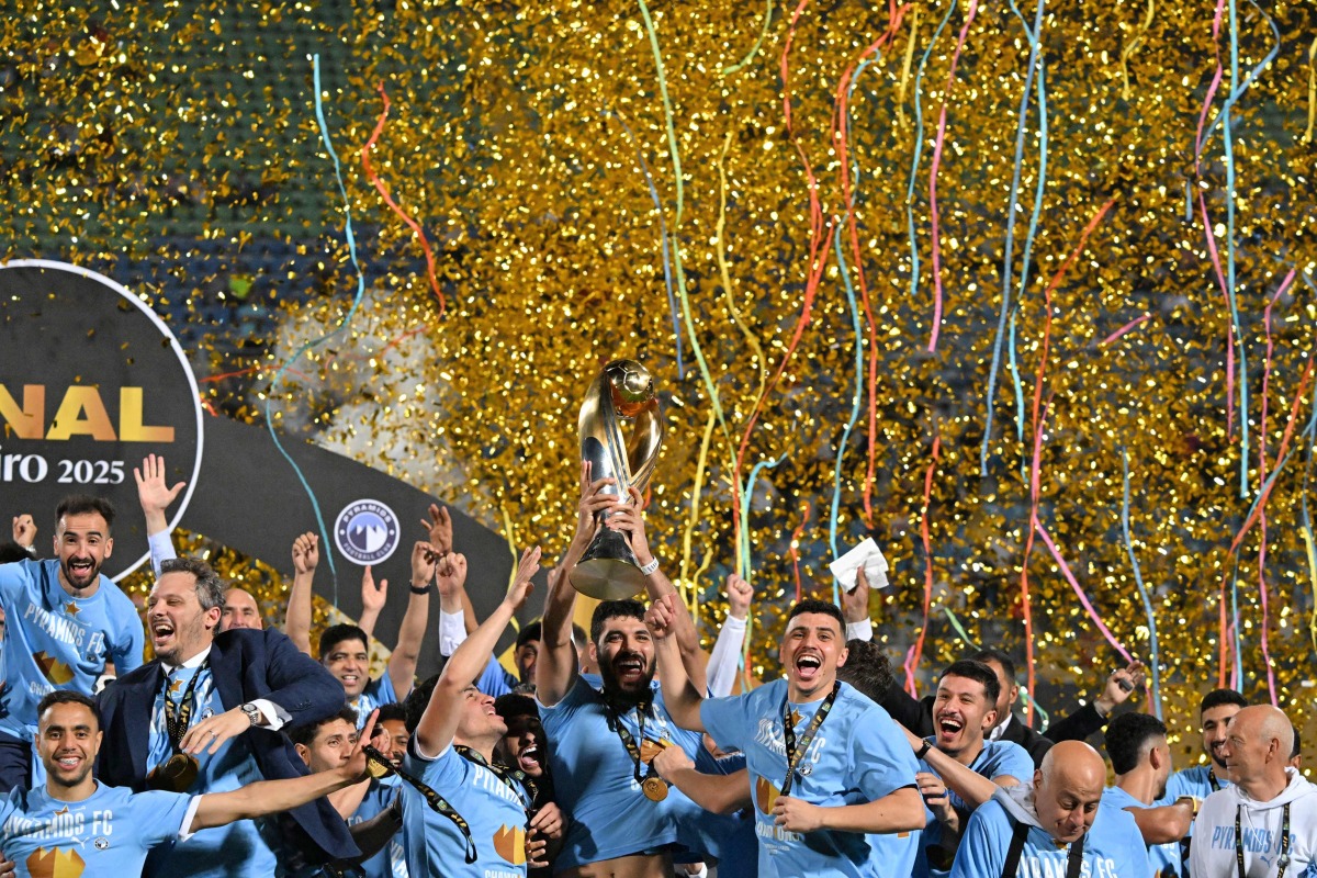 Pyramids' players celebrate winning the CAF Champions League final football match between Pyramids FC and Mamelodi Sundowns at 30 June Stadium in Cairo on June 1, 2025. (Photo by Khaled DESOUKI / AFP)
