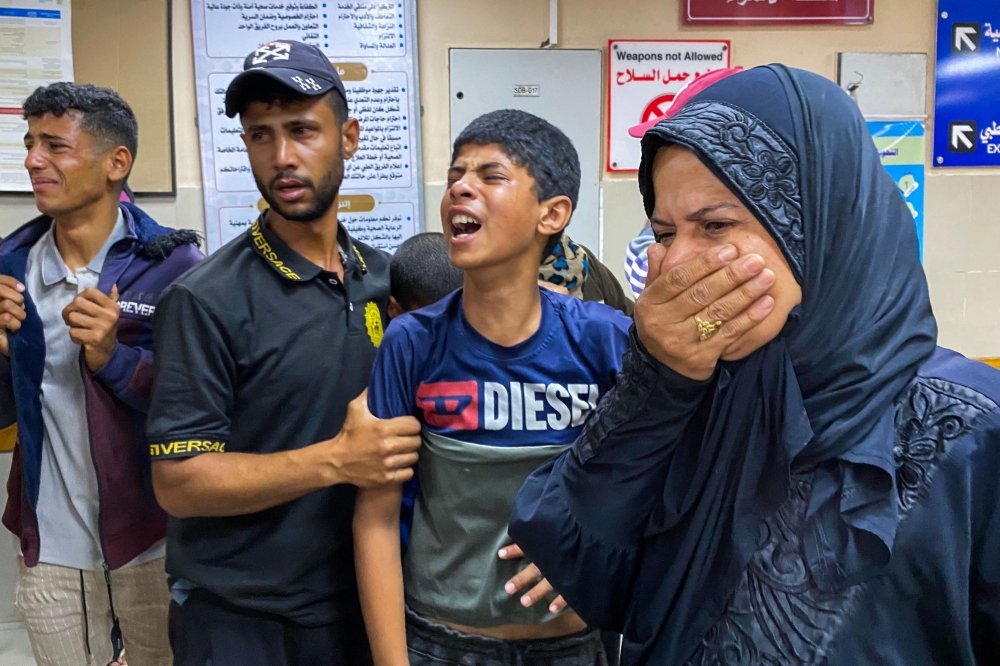 Palestinians react as they await news of a relative who was injured in Israeli strikes in Khan Yunis, at the Nasser hospital in the southern Gaza Strip on June 3, 2025. (Photo by AFP)