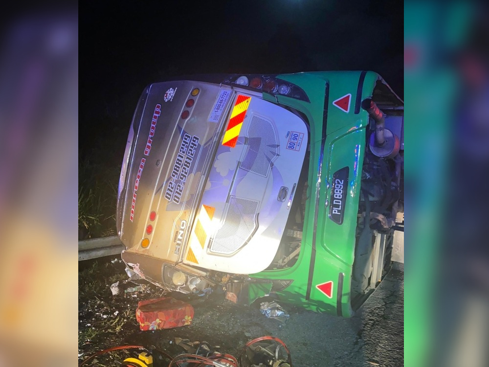 This handout photo taken and released by Perak's Fire and Rescue Department on June 9, 2025 shows a bus after it collided with a minivan in Gerik-Jeli, in Malaysia's Perak state. (Photo by Handout / Perak's Fire and Rescue Department / AFP)