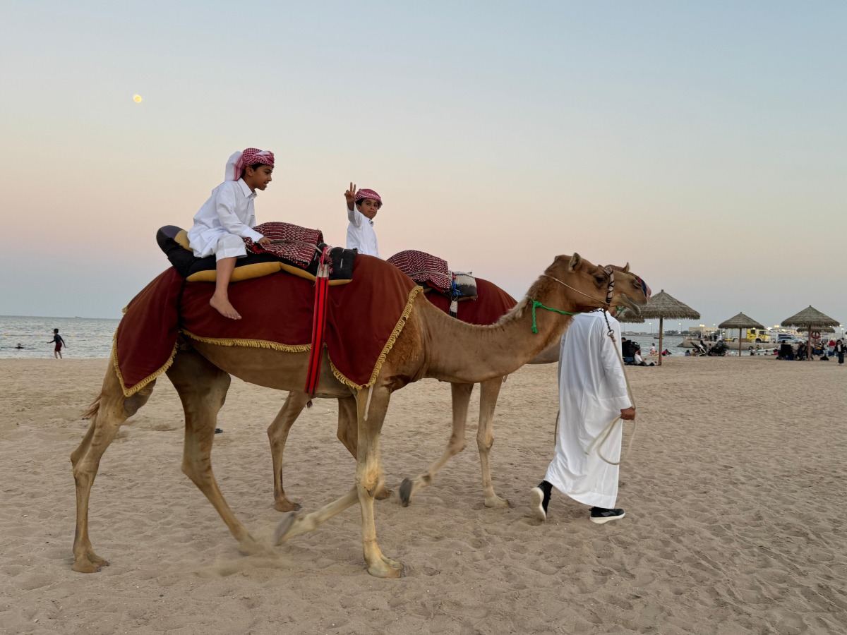 Children enjoying camel rides during the festivities.