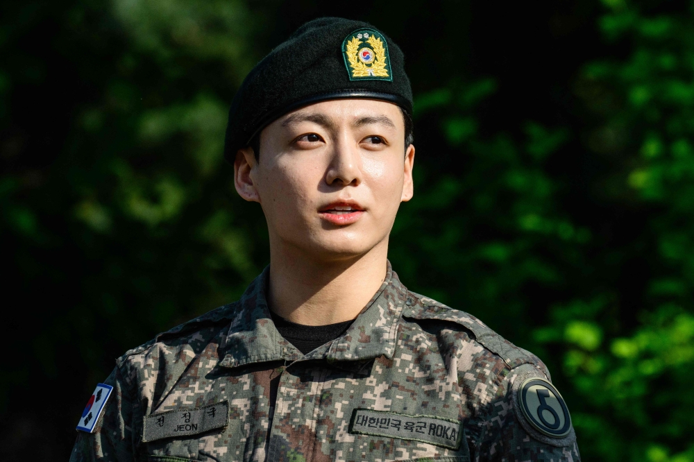 Jungkook of BTS looks on at an outdoor sporting facility in Yeoncheon on June 11, 2025, shortly after his and Jimin's release from South Korean military service. (Photo by Anthony Wallace / AFP)
 