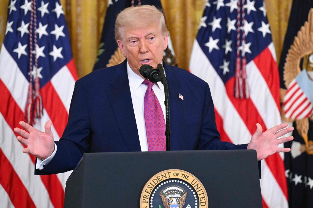 US President Donald Trump speaks before signing a bill blocking California's rule banning the sale of new gas-powered cars by 2035 in the East Room of the White House in Washington, DC on June 12, 2025. (Photo by Saul Loeb / AFP)