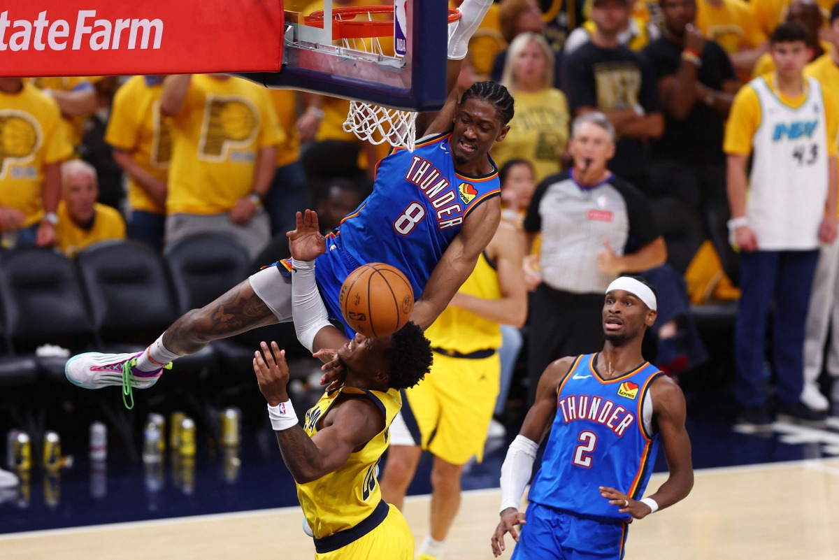 Jalen Williams #8 of the Oklahoma City Thunder drives to the basket against Bennedict Mathurin #00 of the Indiana Pacers during the fourth quarter in Game Four of the 2025 NBA Finals at Gainbridge Fieldhouse on June 13, 2025 in Indianapolis, Indiana. (Photo by Maddie Meyer / GETTY IMAGES NORTH AMERICA / Getty Images via AFP)
