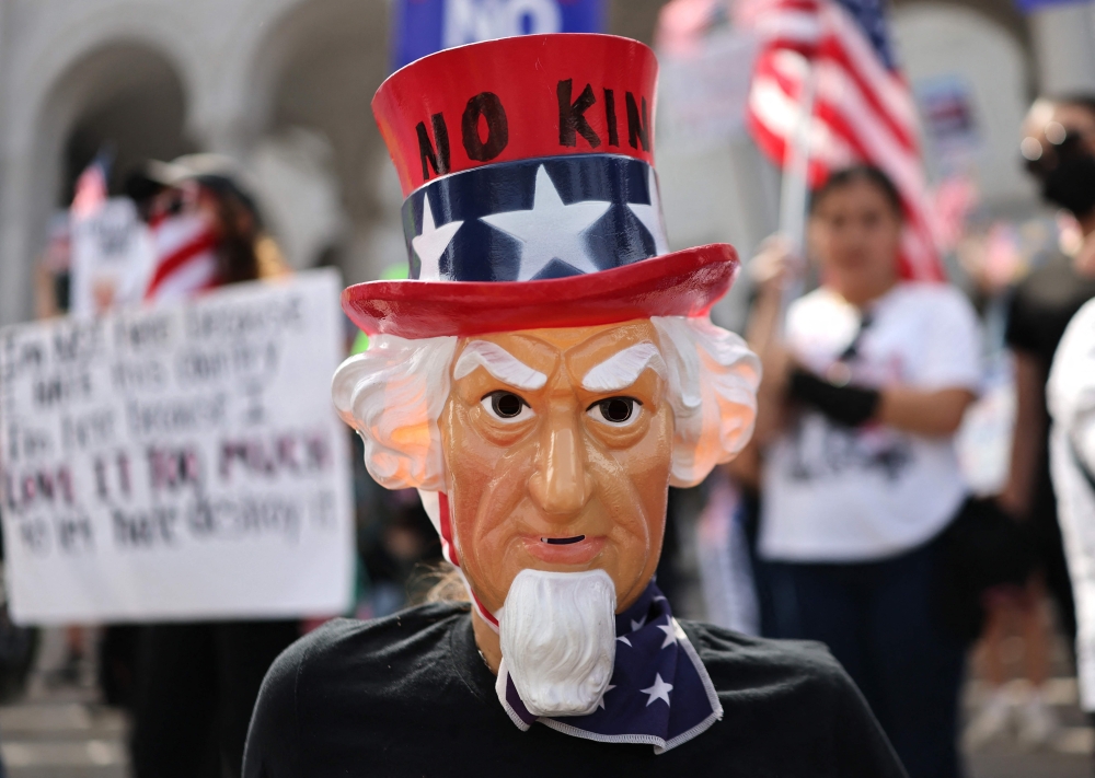 Protesters rally near City Hall during an anti-Trump 
