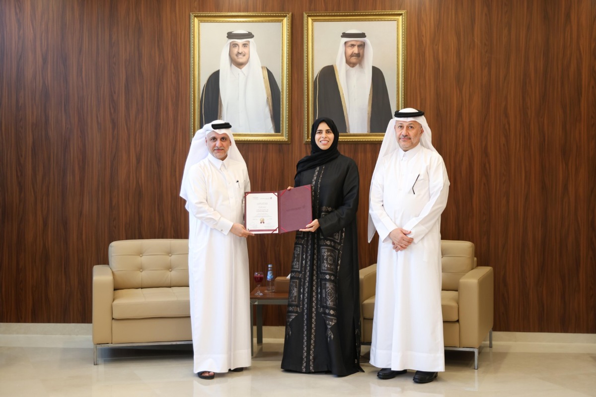 Minister of Education and Higher Education H E Lolwah bint Rashid bin Mohammed Al Khater presenting institutional accreditation to President of CCQ Dr. Khalid Mohamed Al Horr.