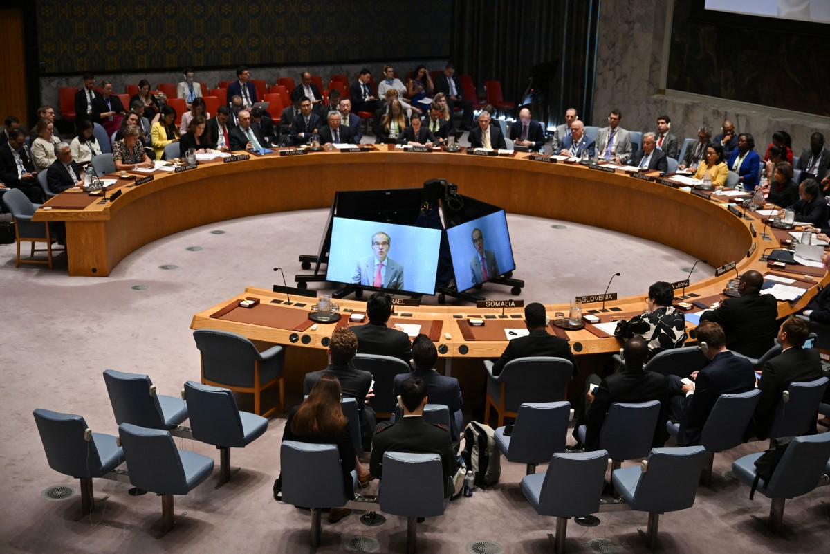 Director General of the International Atomic Energy Agency (IAEA) Rafael Grossi, is seen on a TV screen as he speaks during a United Nations Security Council meeting on the Israel-Iran conflict at the UN headquarters in New York on June 20, 2025. Photo by ANGELA WEISS / AFP.