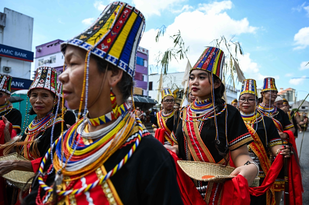Indigenous Bidayuh women take part in a procession during the Gawai Dayak Culture Parade in Kuching, capital of the Malaysian state of Sarawak, on June 21, 2025. (Photo by Mohd RASFAN / AFP)

