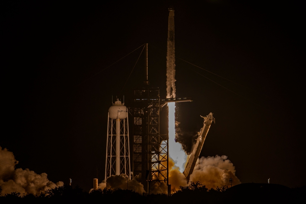 A SpaceX Falcon 9 rocket and Dragon spacecraft lifts off at Launch Complex 39A at NASA Kennedy Space Center before the launch of Axiom Space Axiom Mission on June 25, 2025, in Cape Canaveral, Florida. Miguel J. Rodriguez Carrillo/Getty Images/AFP 