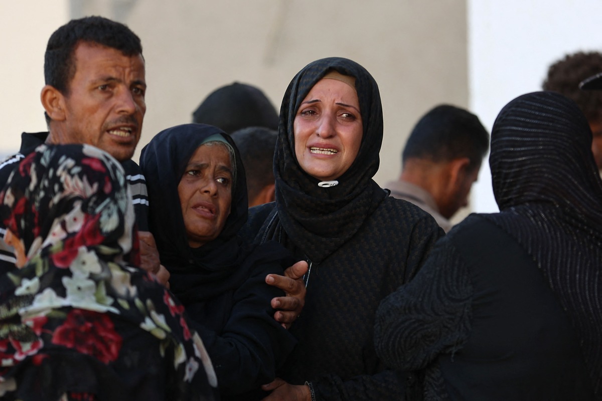 Palestinians mourn outside Al-Shifa hospital in Gaza City, on June 26, 2025, after several people were killed during overnight Israeli strikes. Photo by Omar AL-QATTAA / AFP