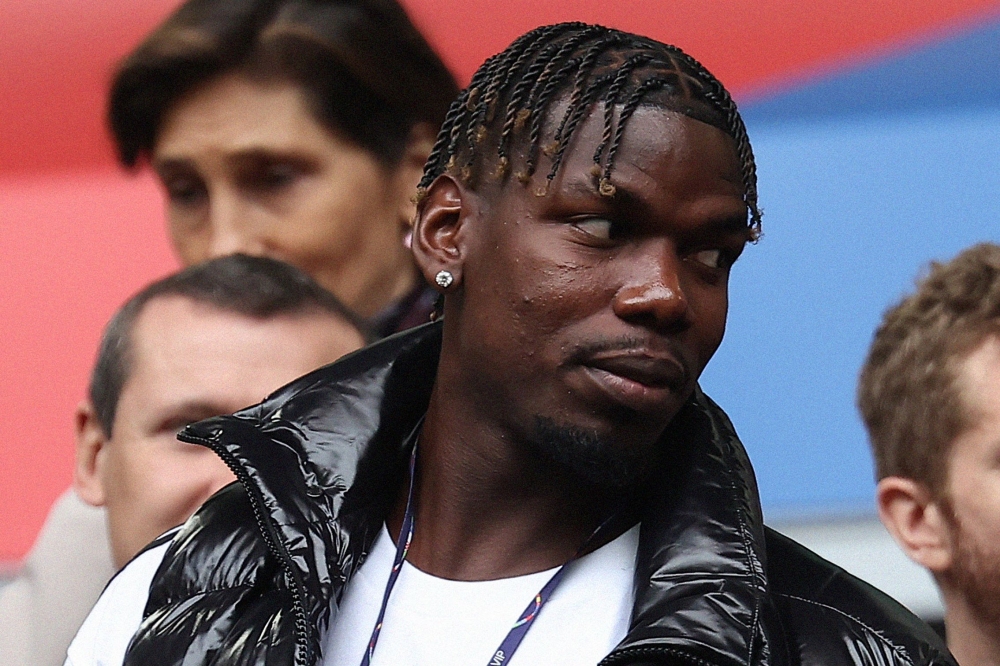 File photo. French midfielder paul Pogba (L) attends the UEFA Euro 2024 round of 16 football match between France and Belgium at the Duesseldorf Arena in Duesseldorf on July 1, 2024. (Photo by FRANCK FIFE / AFP)


