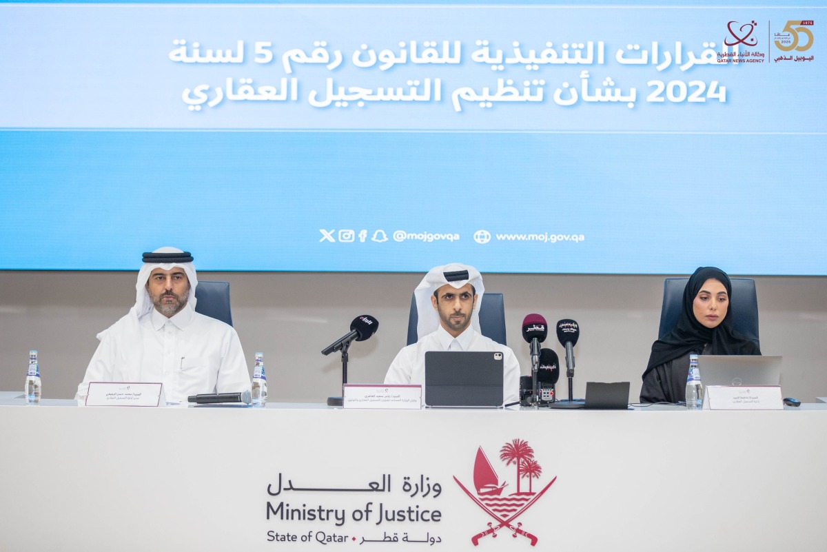 Assistant Undersecretary for Real Estate Registration and Documentation Affairs at the Ministry of Justice Amer Saed Ali Al Ghafri with other officials during the event.