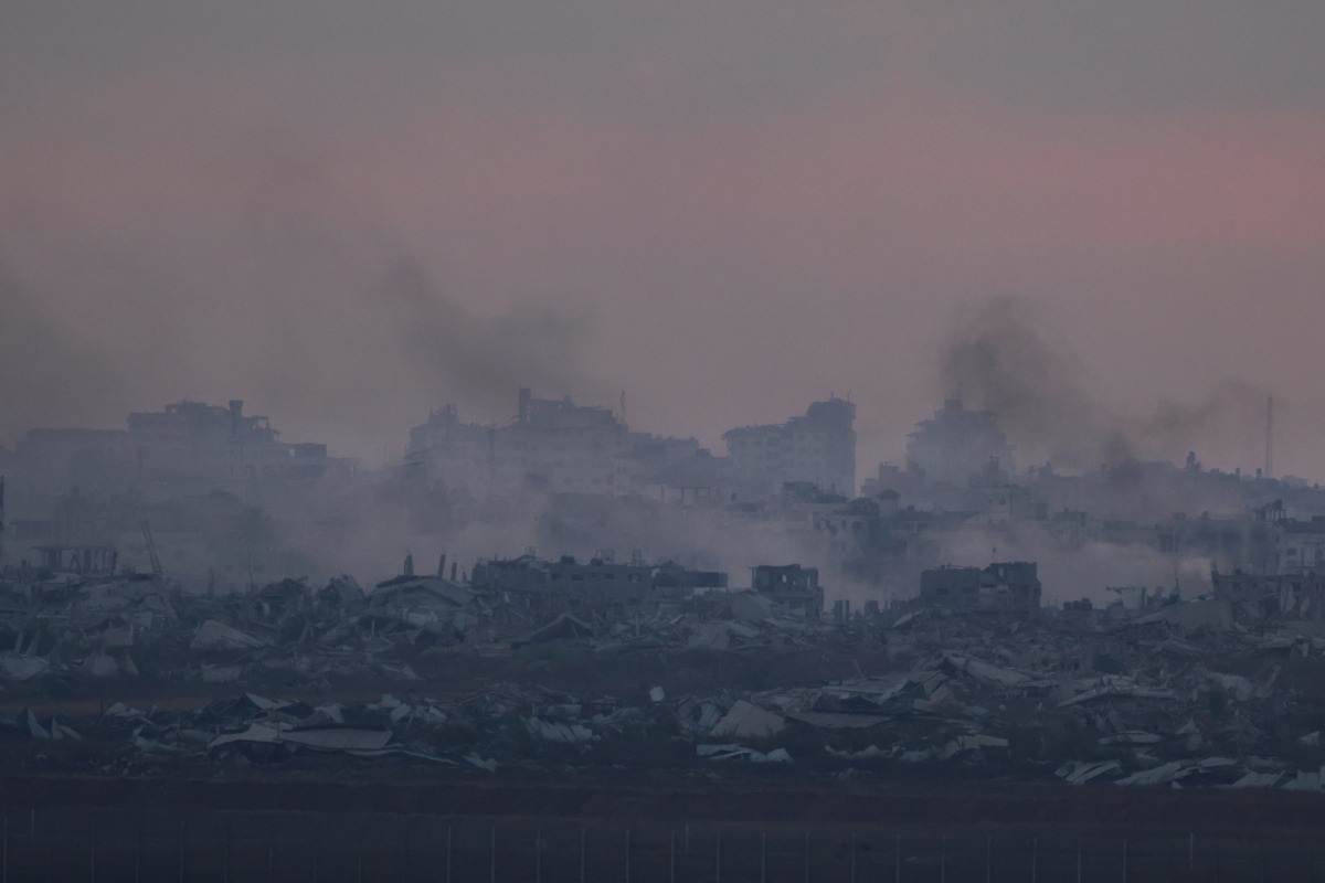 This picture taken from a position at Israel's border with the Gaza Strip shows smoke billowing after an Israeli strike on the besieged Palestinian territory on July 3, 2025. Photo by Menahem Kahana / AFP.
