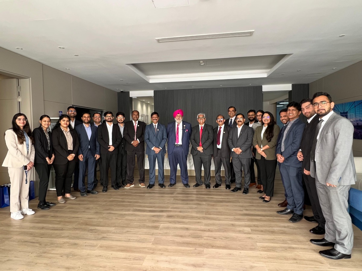 ICAI leadership delegation pose with KPMG staff.