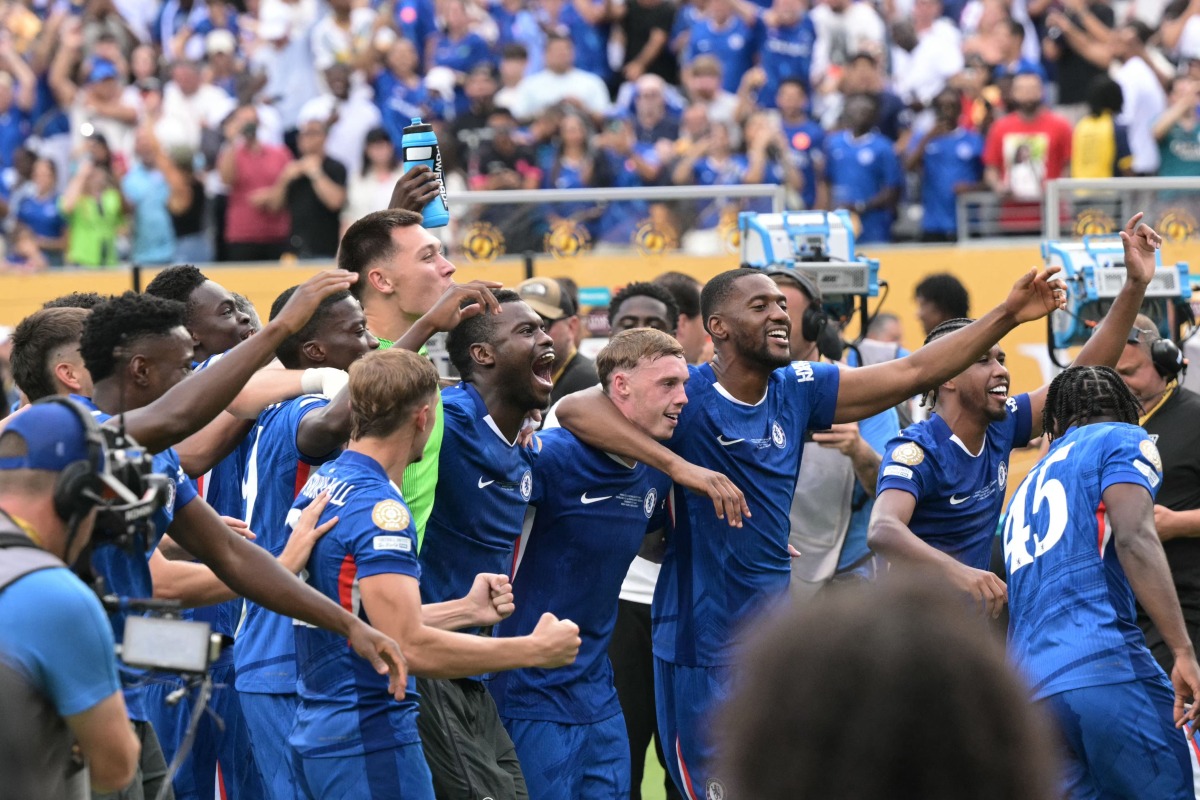 Chelsea's players celebrate their team's victory at the end of the FIFA Club World Cup 2025 final football match between England's Chelsea and France's Paris Saint-Germain at the MetLife Stadium in East Rutherford, New Jersey on July 13, 2025. (Photo by JUAN MABROMATA / AFP)