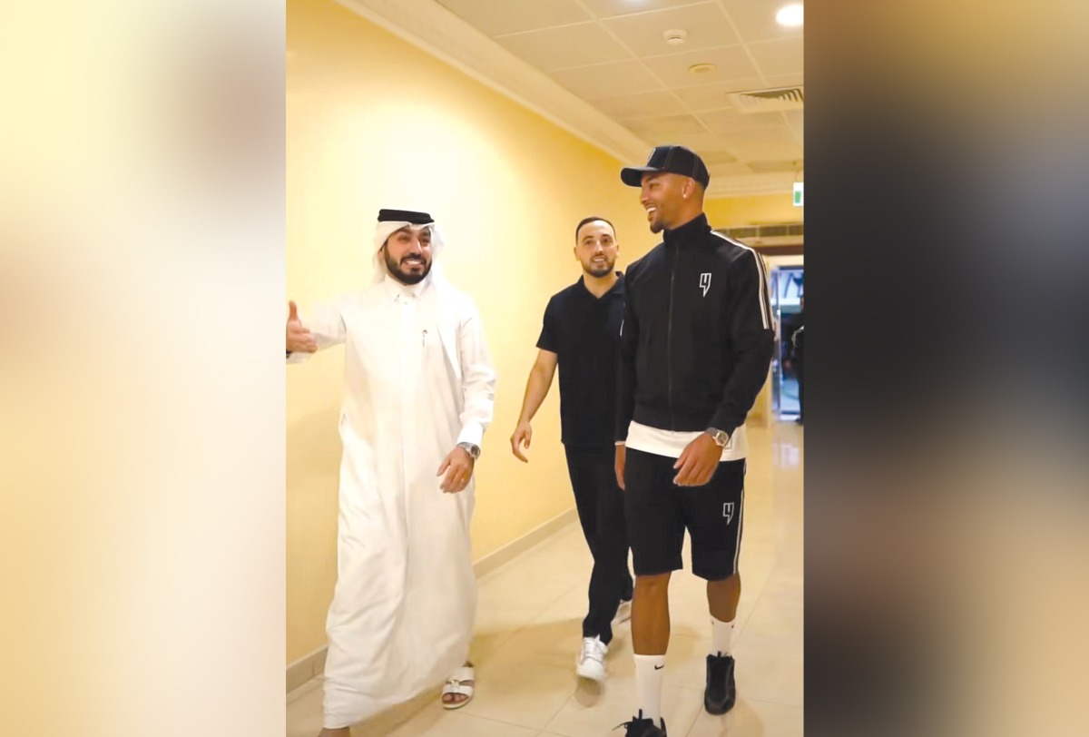 Al Gharafa's new signing Mason Holgate (right) arrives at the Club's headquarters.